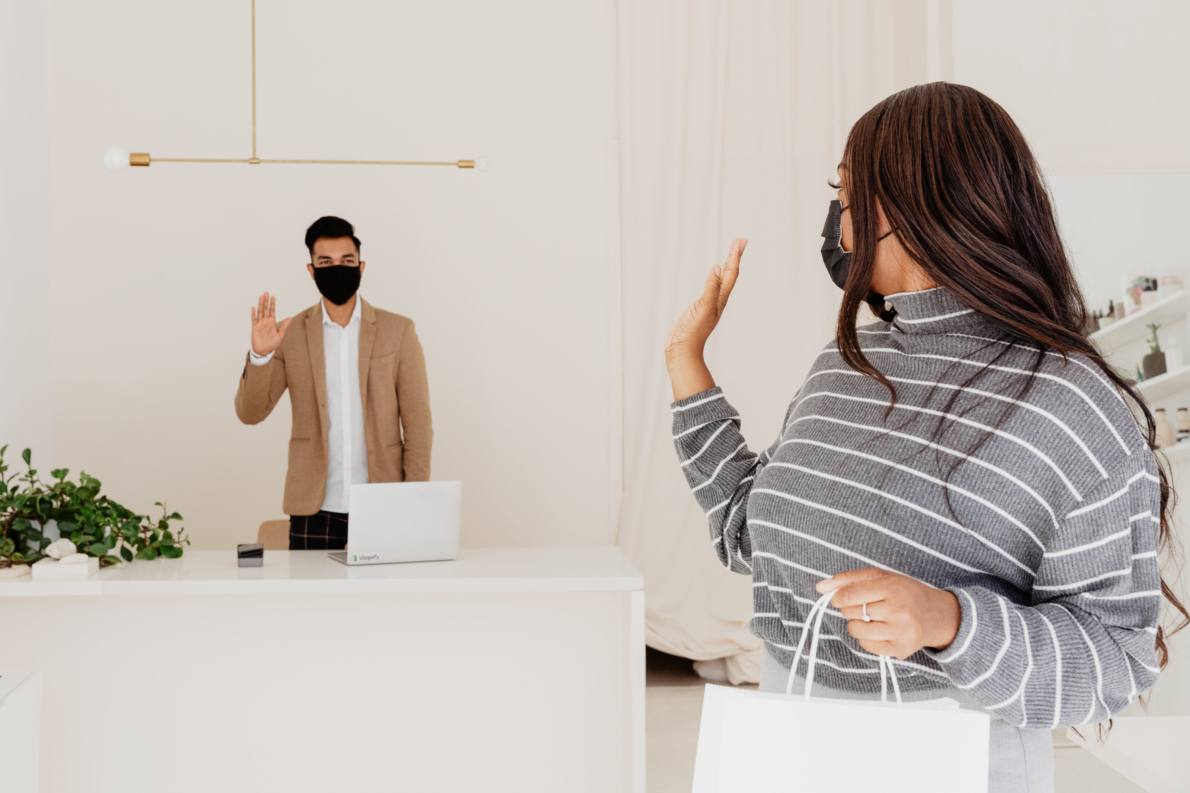 customer-and-store-owner-waving-goodbye.jpg